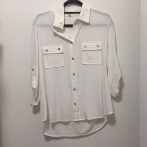 White flowy top with golden bottons